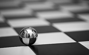 stainless steel ball on black and white checkered board digital wallpaper
